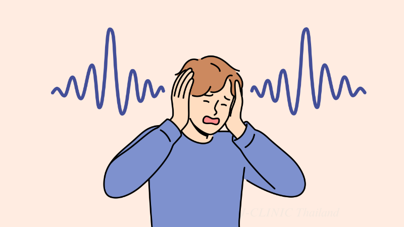 耳を苦しそうに押さえている男性