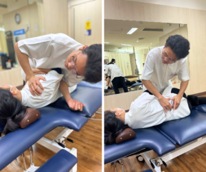 横向きになっている人をマッサージしているセラピスト