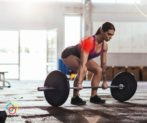 A woman is trying to lift dumbbells