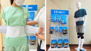 サポーターを腰にまいている患者様とそれをサポートしているセラピスト