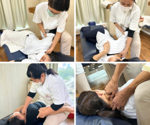 治療を受ける人に横になってもらい、上腕骨を動かしながら筋肉の緊張を緩めるテクニックを練習するセラピストたち