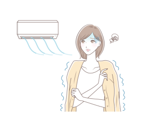 冷房のきいた部屋で寒がっている女性