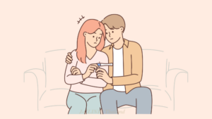 ソファに座って妊娠検査の結果を見ている夫婦