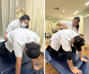 四つん這いになった人を後ろから手でサポートするセラピスト